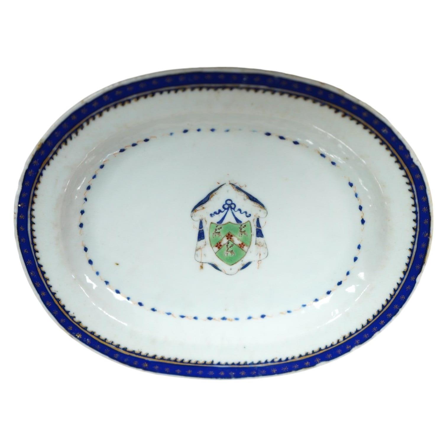 A small 18th century Chinese armorial porcelain oval dish, 16cm. Condition - fair